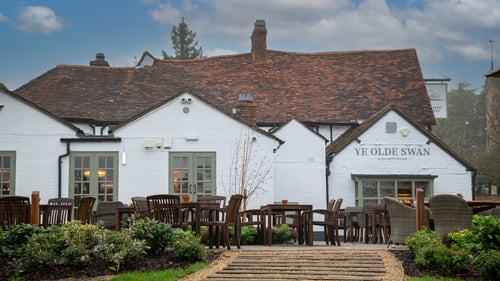 Exterior of pub with seating area