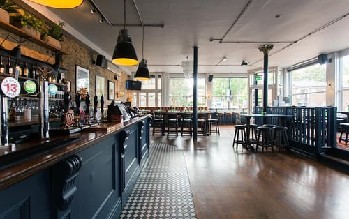 the dining area and bar of a pub