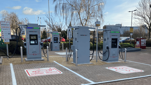 Ultra-rapid InstaVolt EV chargers at DFS Gateshead with visible signage and dedicated electric vehicle parking bays.