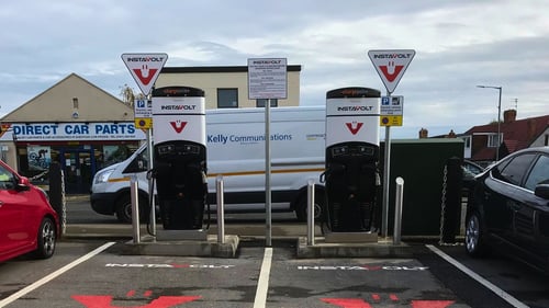 InstaVolt ultra rapid EV chargers in a car park near a Direct Car Parts store