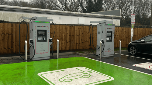 InstaVolt ultra-rapid EV chargers in a McDonald’s car park with green marked charging bays.
