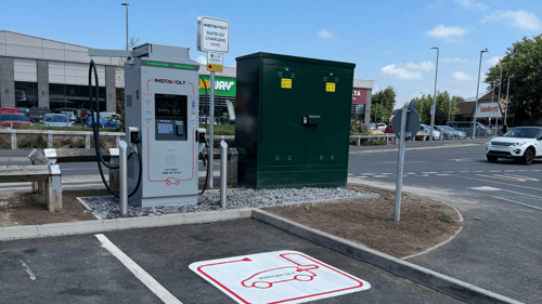 Ultra rapid InstaVolt EV charger at Gallagher Retail Park in Bridgwater with nearby shops including Subway and Sainsbury’s visible in the background.