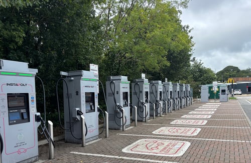 InstaVolt electric vehicle charging station surrounded by greenery in Bodmin retail park