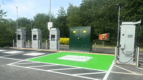 InstaVolt ultra rapid EV chargers at a dedicated charging bay on Power Station Road, Rugeley, with clear signage and green-marked EV spaces.