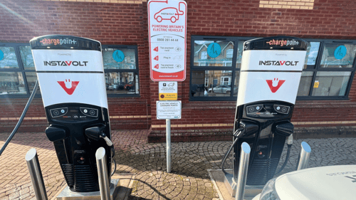 Two InstaVolt EV chargers outside The Deane House in Taunton, ready for contactless charging.