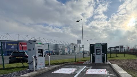 InstaVolt ultra rapid EV chargers at McDonald's Capitol, Cardiff, located in Capitol Shopping Park with Cardiff City Stadium in the background.