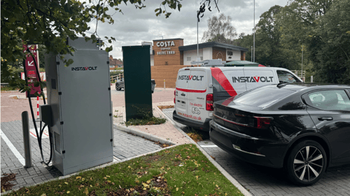 Ultra-rapid InstaVolt EV chargers located at Costa Coffee Drive Thru in Topaz Business Park, Bromsgrove, with electric vehicles parked and charging.
