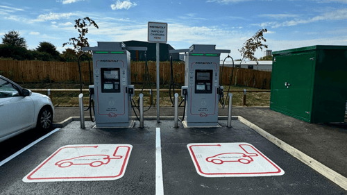 InstaVolt ultra rapid EV chargers at McDonald's Phoenix Road, Haverhill, with clearly marked charging bays and modern infrastructure under a blue sky.