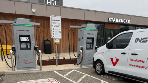 InstaVolt ultra-rapid EV chargers outside Starbucks Doncaster on Water Vole Way, with an electric InstaVolt van parked at the charging bay.