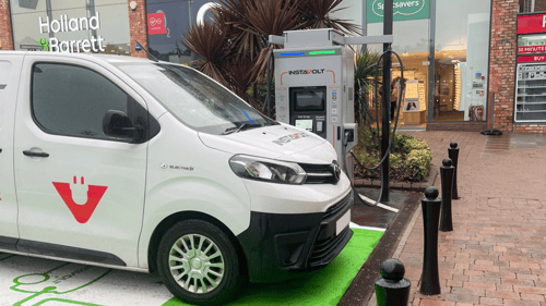 Ultra-rapid InstaVolt EV charger located at Marshall’s Yard, Gainsborough, with marked charging bay and retail shops in the background.