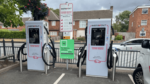 EV charging bays with InstaVolt ultra-rapid chargers and usage instructions on site