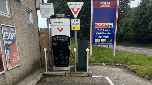 InstaVolt charger installed at roadside service station in Huntly, Aberdeenshire, offering rapid EV charging next to Costa and Spar with jet wash and convenience facilities.