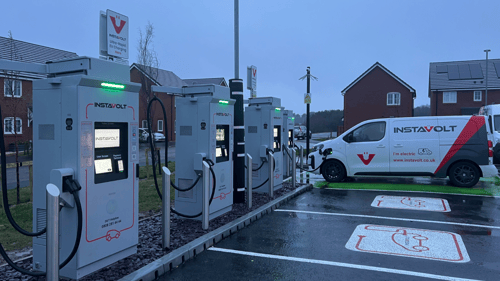 InstaVolt ultra-rapid EV chargers at Noble Road Cannock with marked charging bays and residential homes in the background.