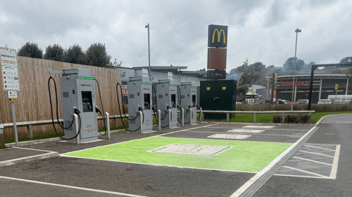 InstaVolt ultra-rapid EV chargers at McDonald's car park in Leek, with Sainsbury's visible in the background.