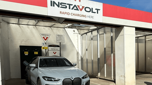 InstaVolt rapid charging point in Braunton with clear branding, signage and a BMW EV in charge session beneath a covered bay.