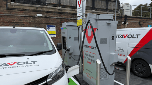 InstaVolt electric vehicle charging station featuring ultra-rapid chargers and clear signage in a car park setting.