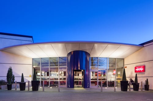 Exterior shot of Mercure Chester Abbots Well Hotel at dusk