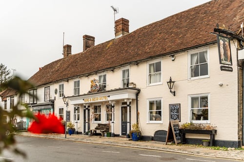 Exterior view of the Dog & Bear Hotel, a historic coaching inn in Lenham, Kent.
